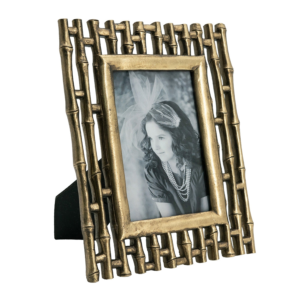 Antique gold bamboostyle photo frame with a vintage portrait of a young girl