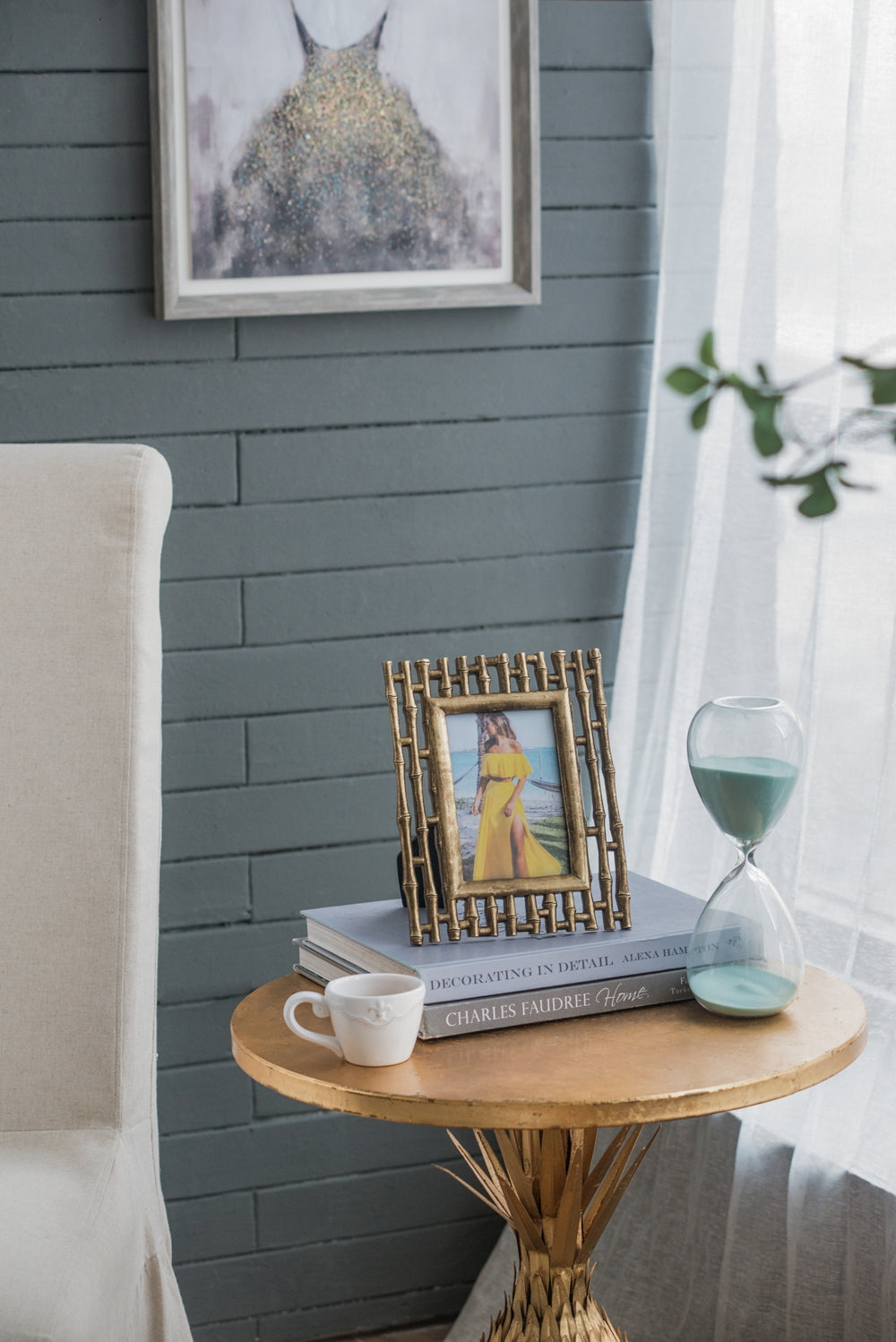 Gold bamboo photo frame with woman in yellow dress decorative table accent