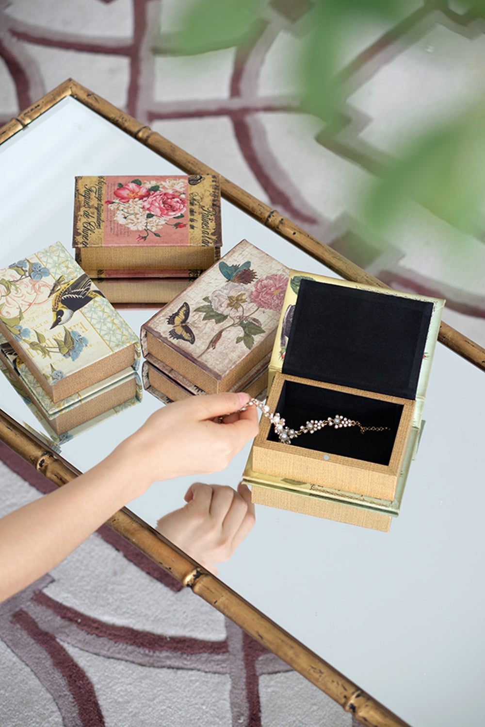 Decorative jewelry box with vintage floral and bird designs perfect for storing precious trinkets