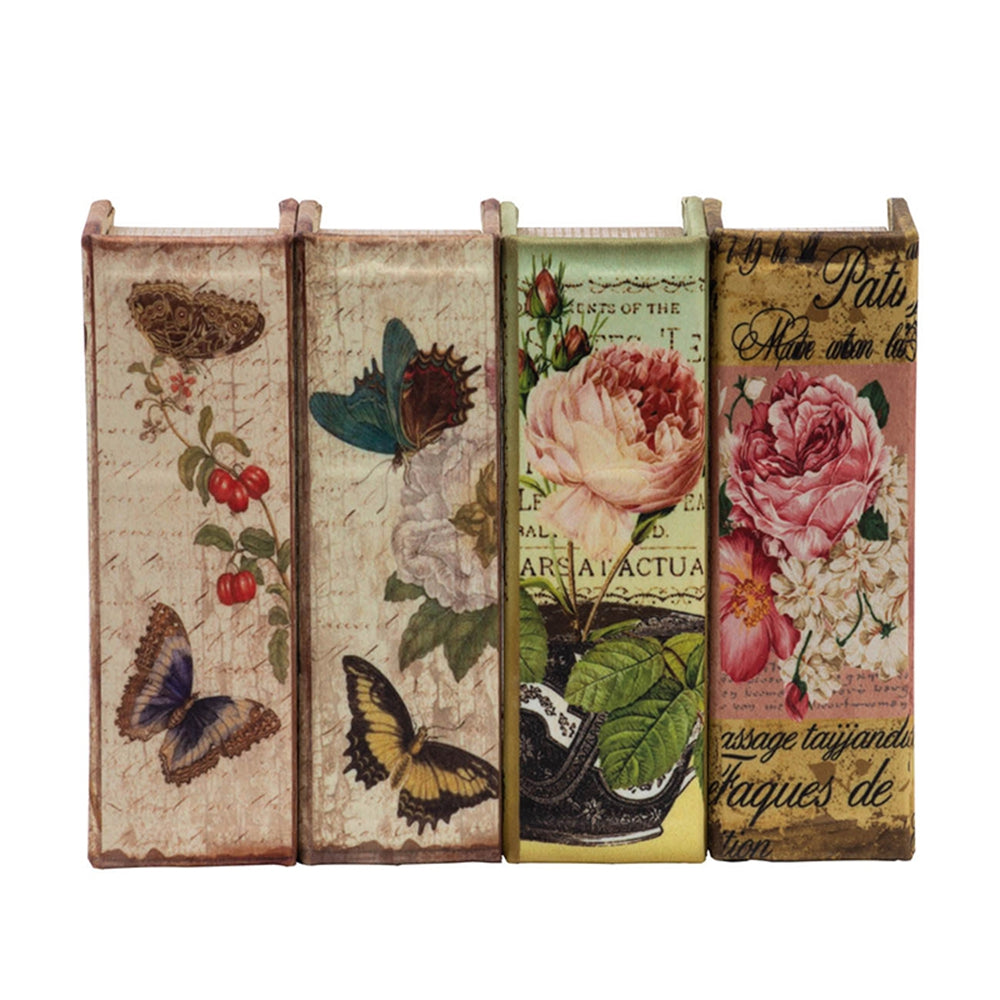Vintage decorative book with blue butterfly and floral art