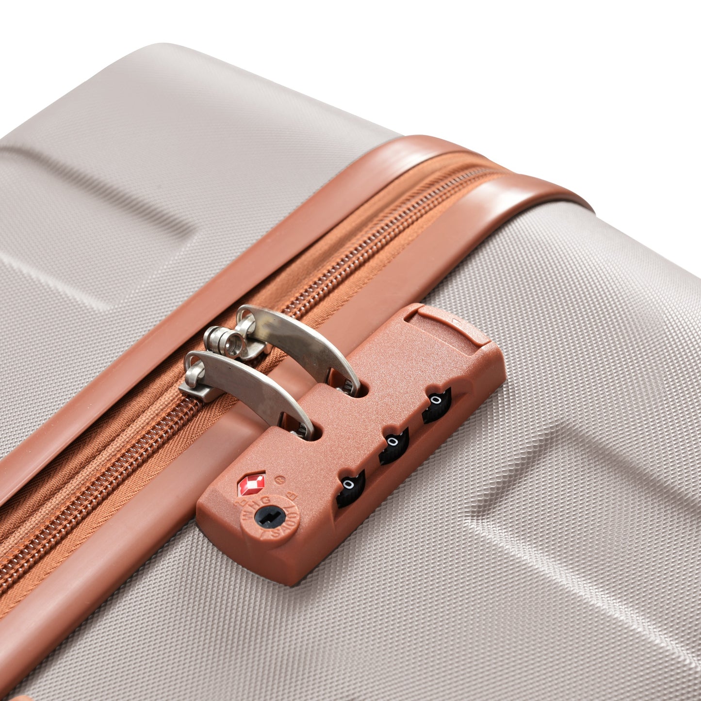 Closeup of a silver luggage with a brown zipper and TSAapproved combination lock
