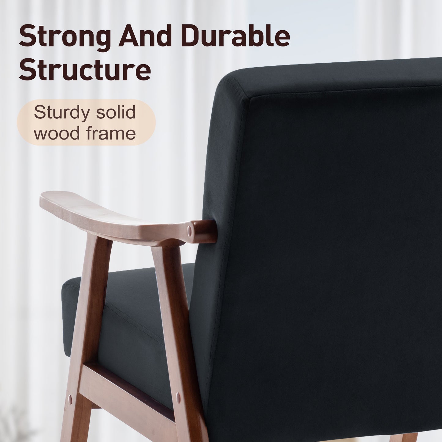 Close up of a black armchair with a sturdy solid wood frame ideal for living rooms