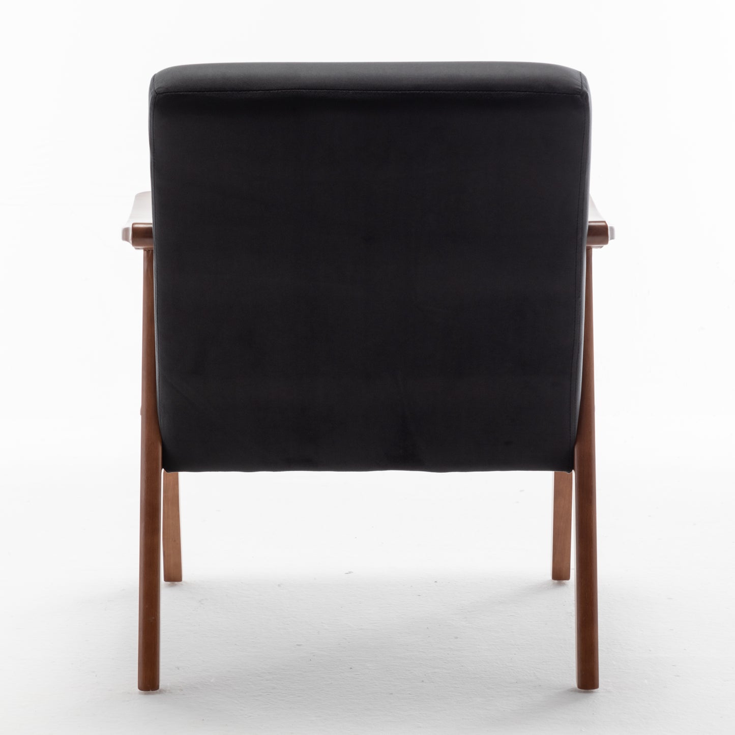 Back view of a black leather armchair with wooden legs modern accent chair