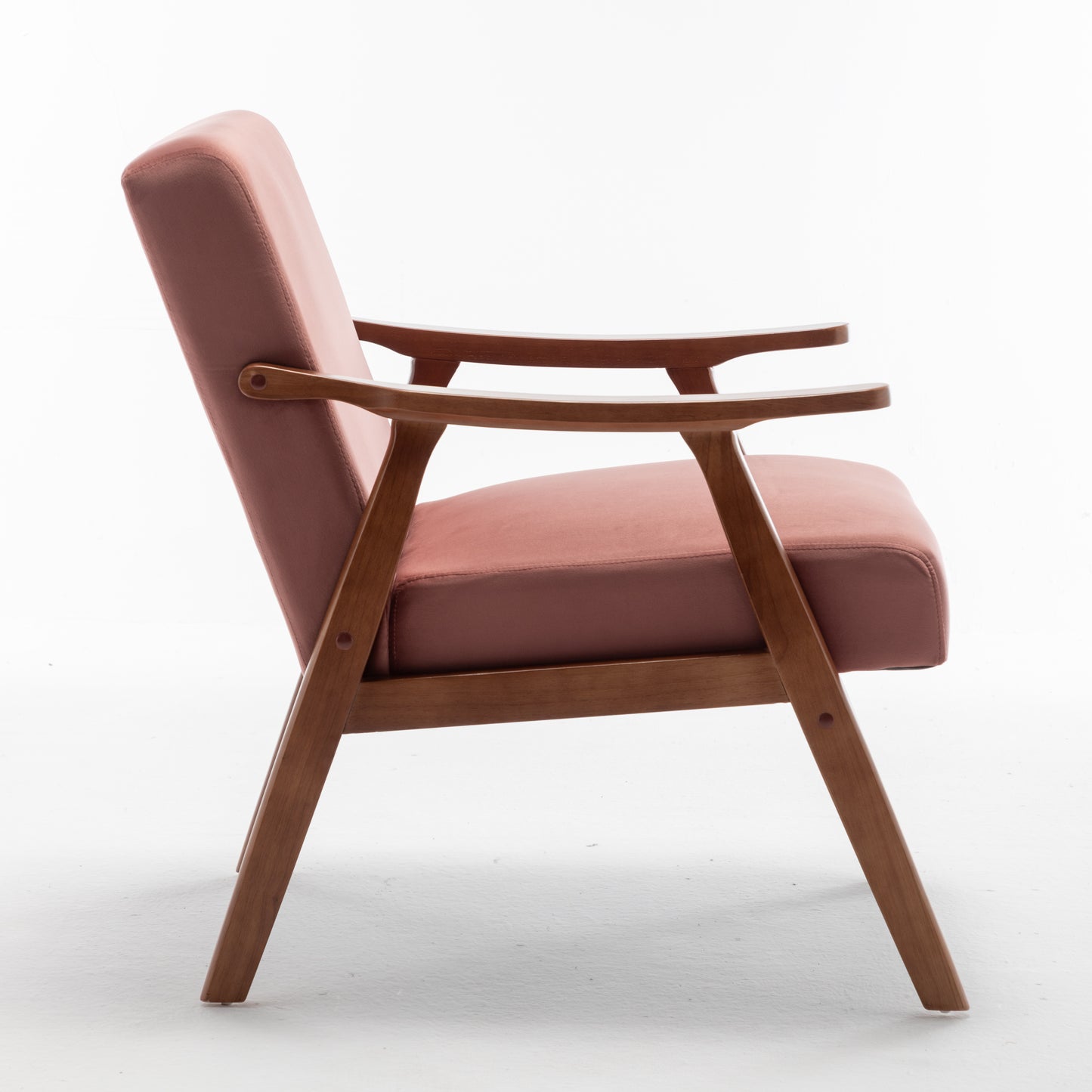 Dusty rose velvet armchair with curved wooden frame and arms midcentury modern design