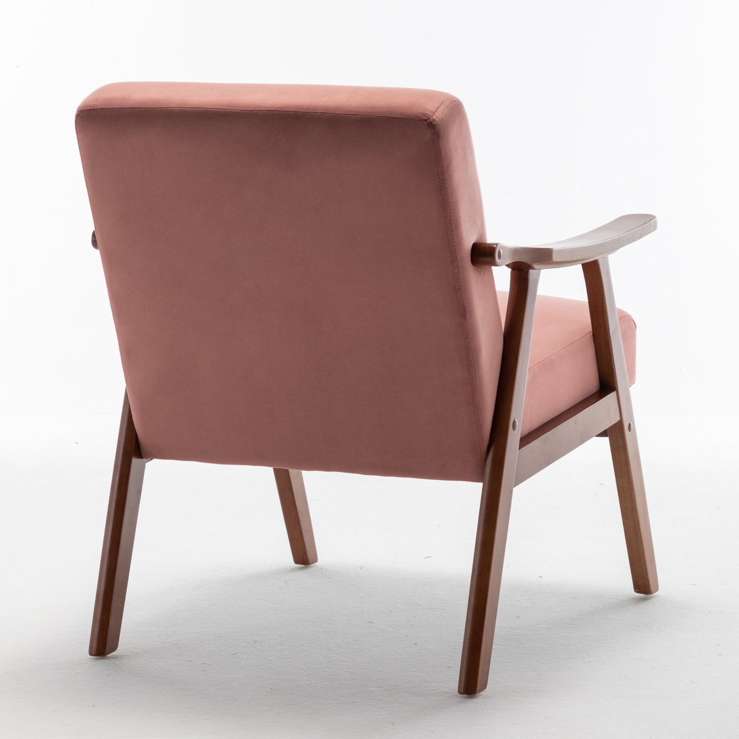 Dusty rose velvet armchair with curved wooden arms and legs