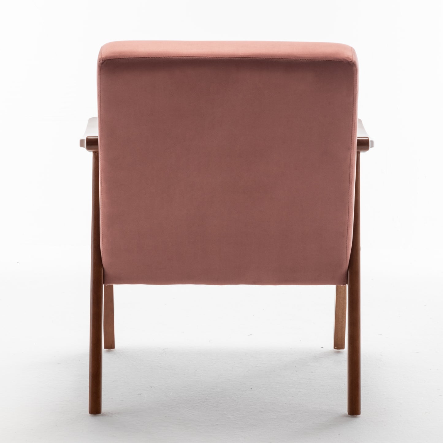 Rose velvet armchair with minimalist wooden frame perfect for a modern living room