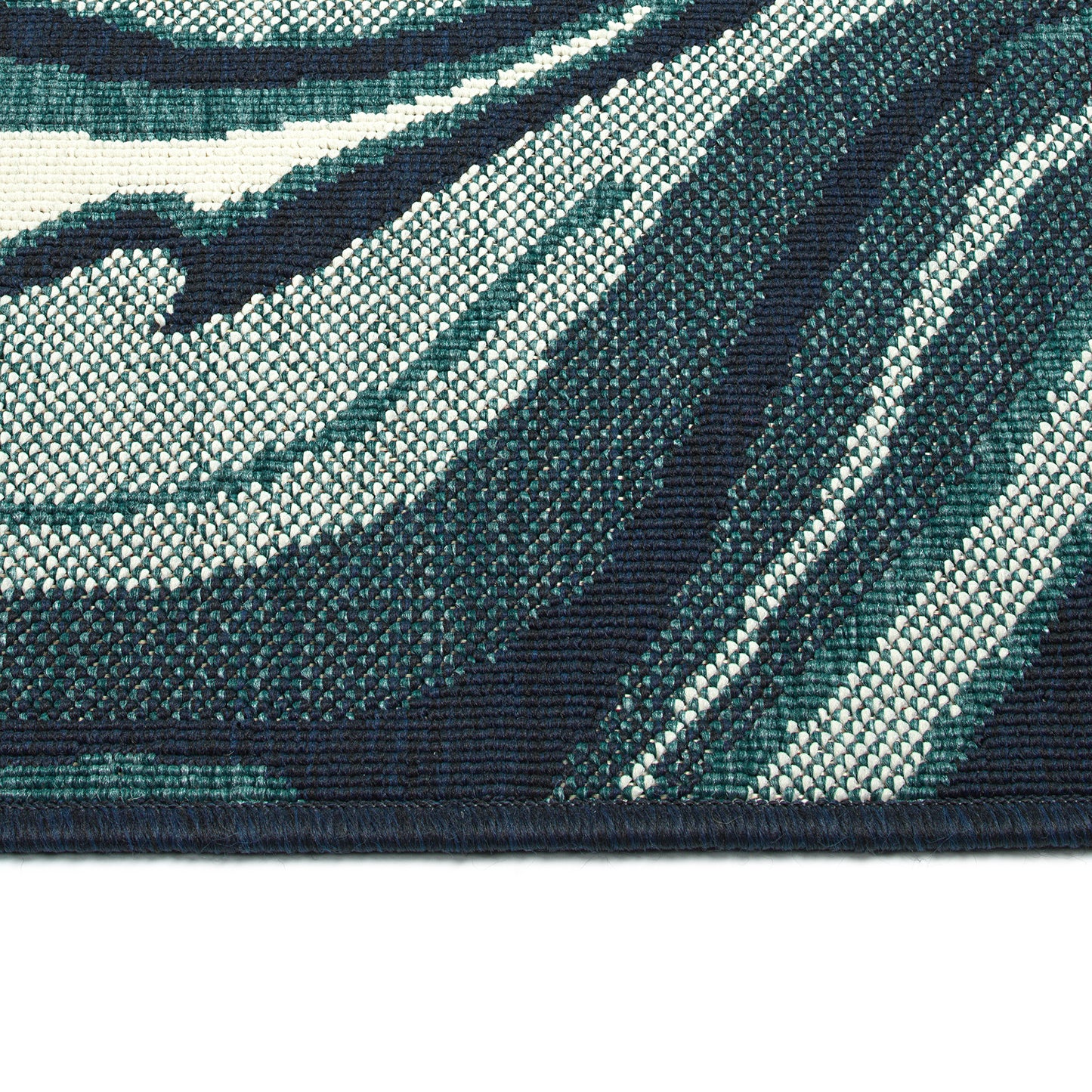 Closeup textured view of a blue and white abstract striped area rug