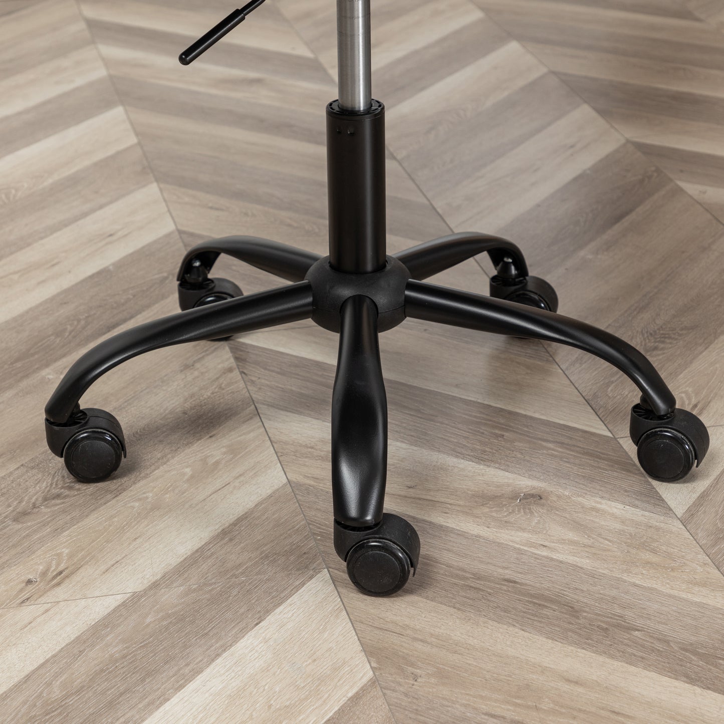 Black fivestar office chair base with dualwheel casters offering smooth mobility