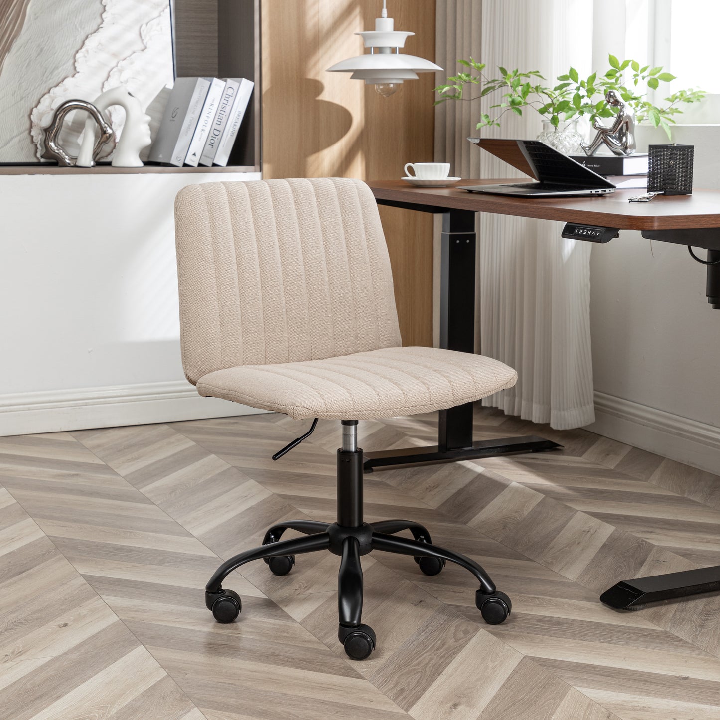Beige upholstered office chair with adjustable height and rolling casters