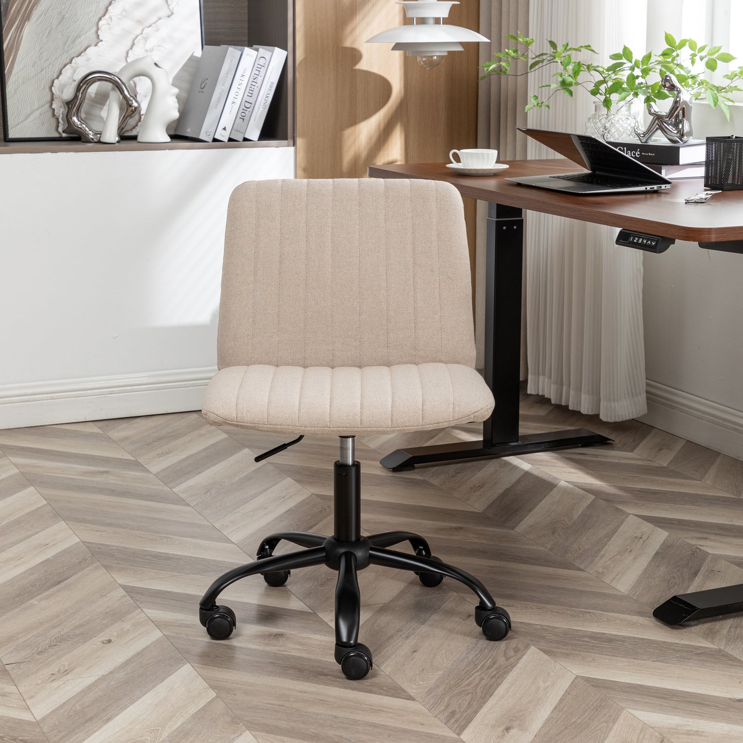 Beige upholstered office chair with lumbar support and black casters