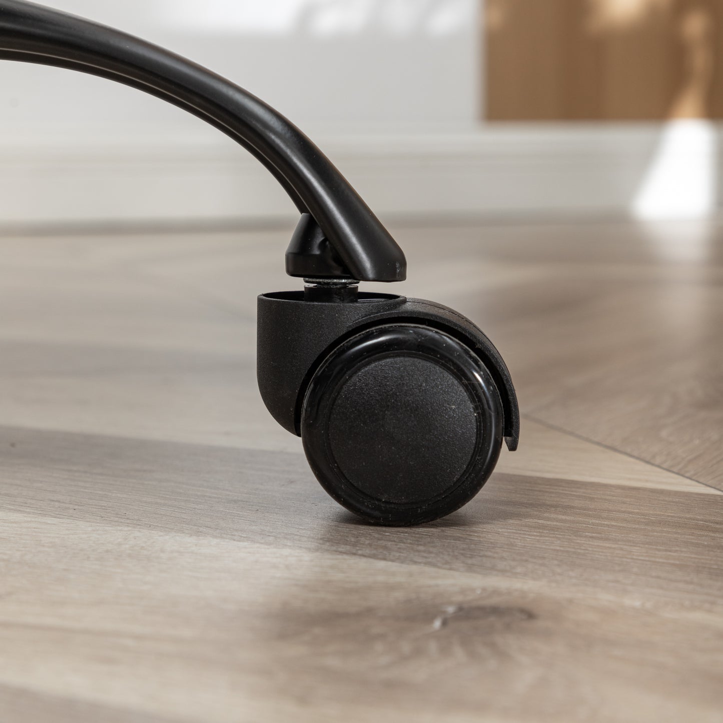 Black office chair caster wheel with metal stem for smooth mobility