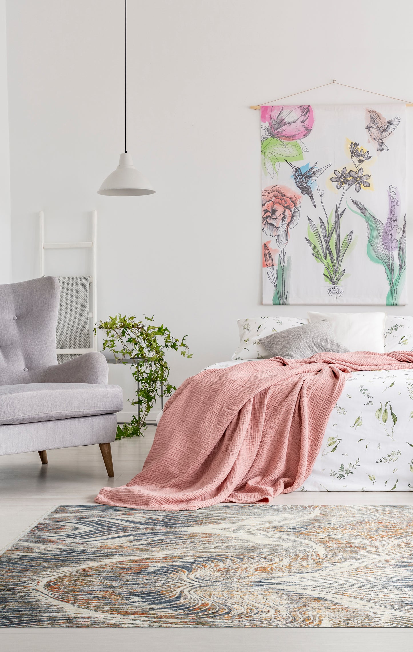Dusty rose textured throw blanket draped elegantly over a bed with botanical print bedding