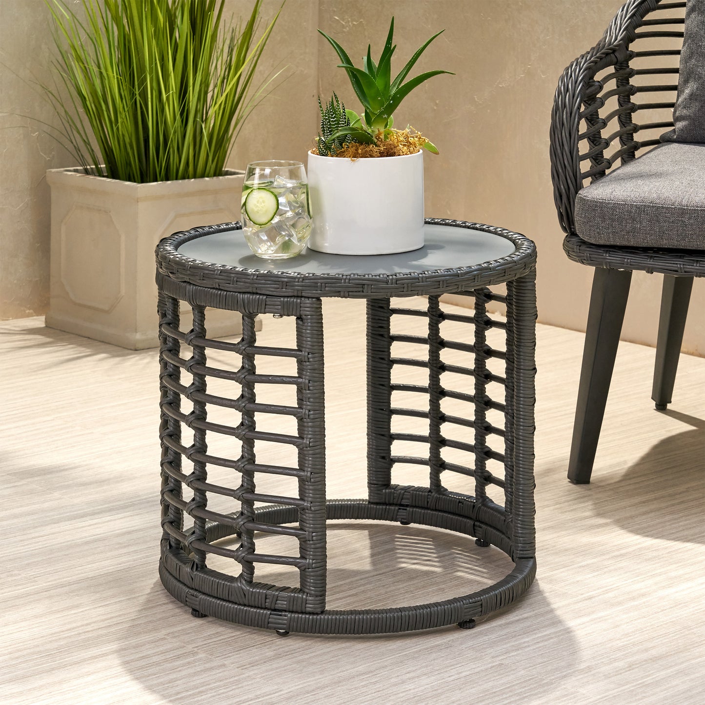 Dark gray wicker round side table with glass top perfect for outdoor patios