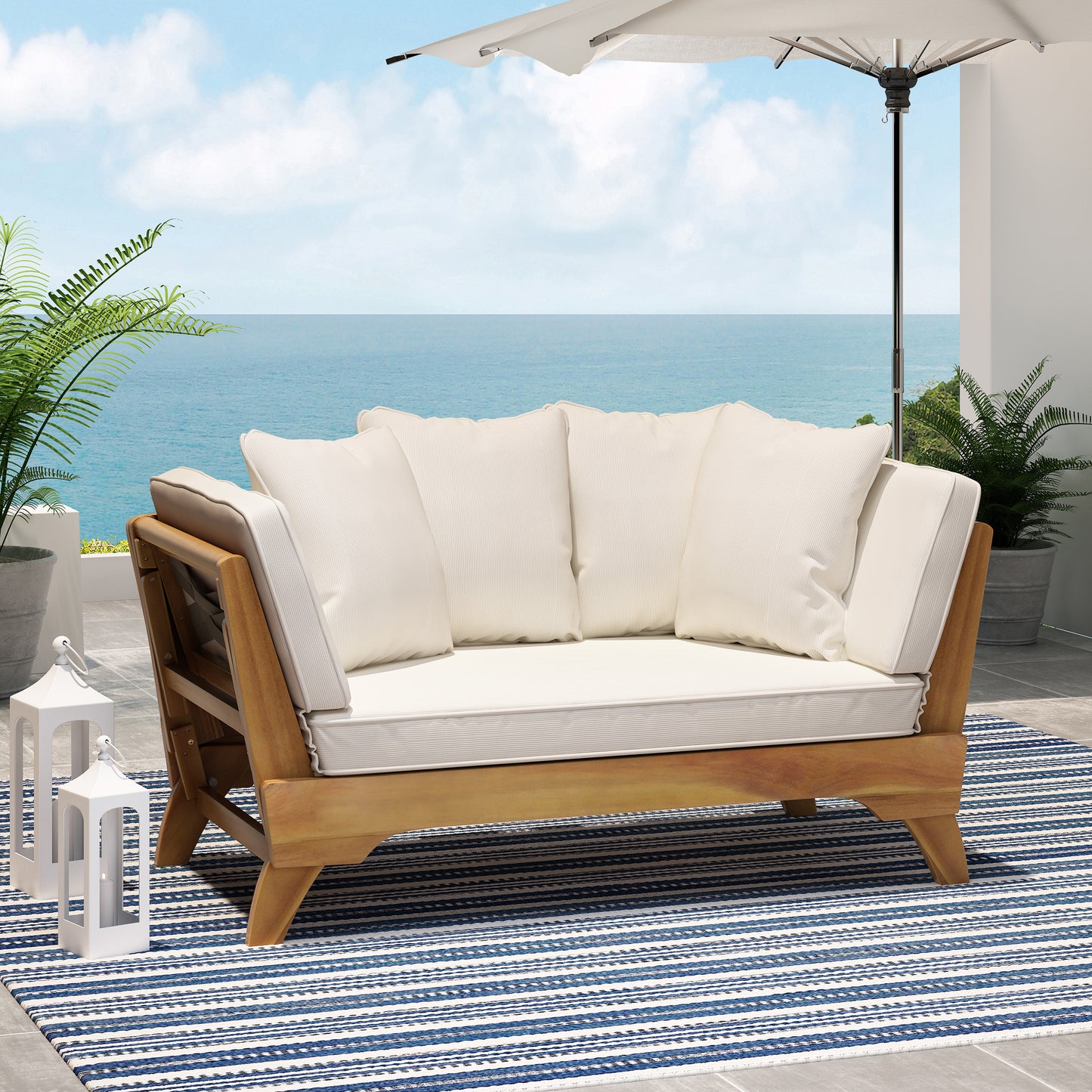 Teak outdoor loveseat with plush cream cushions and modern slatted design perfect for patios