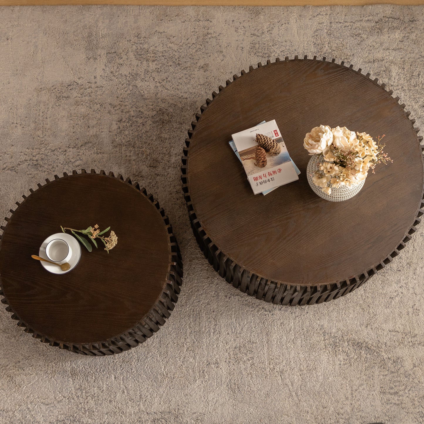 Round dark wood coffee table with ribbed base and textured rug perfect for living rooms