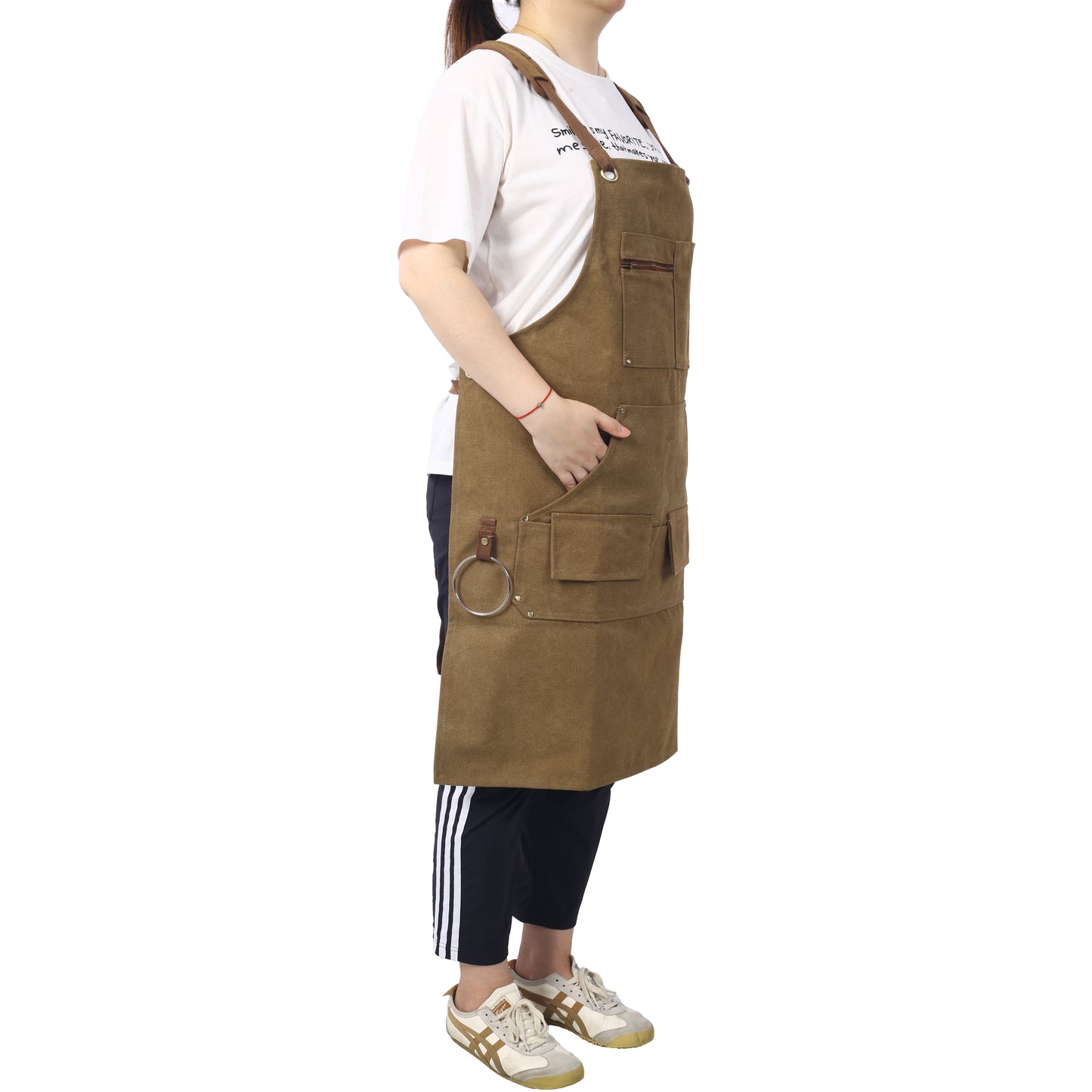 Brown canvas apron for men featuring adjustable straps multiple pockets and a ring for tools