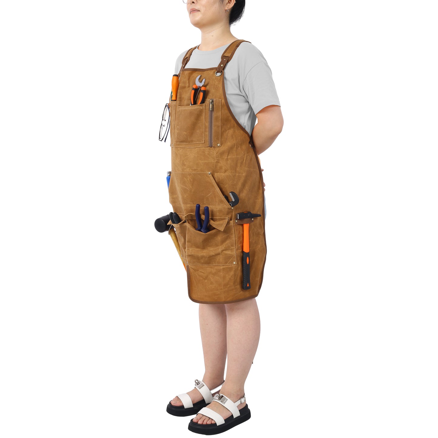 Durable brown canvas utility apron for carpenters with multiple tool pockets
