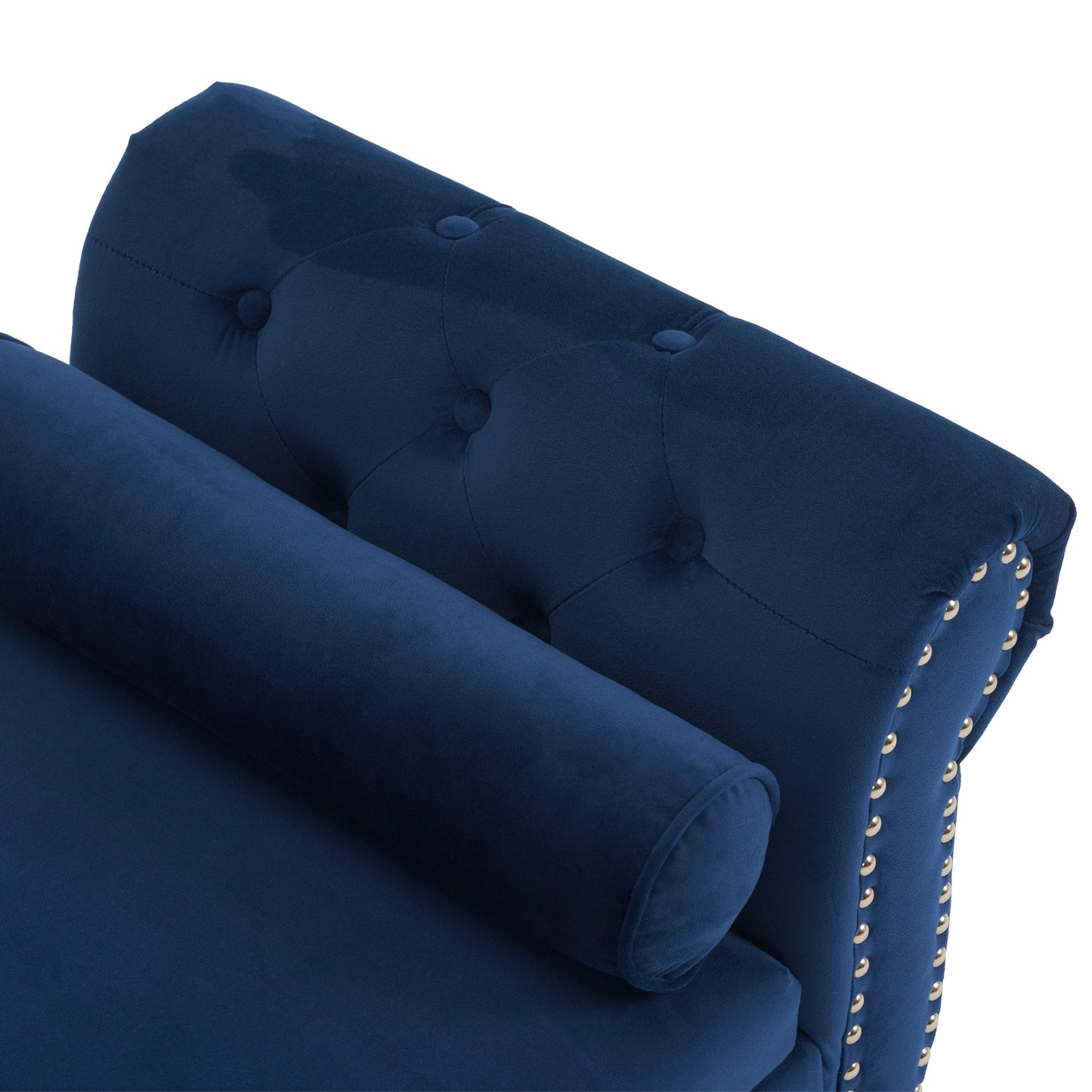 Closeup of a deep blue velvet bench with button tufting and brass nailhead trim