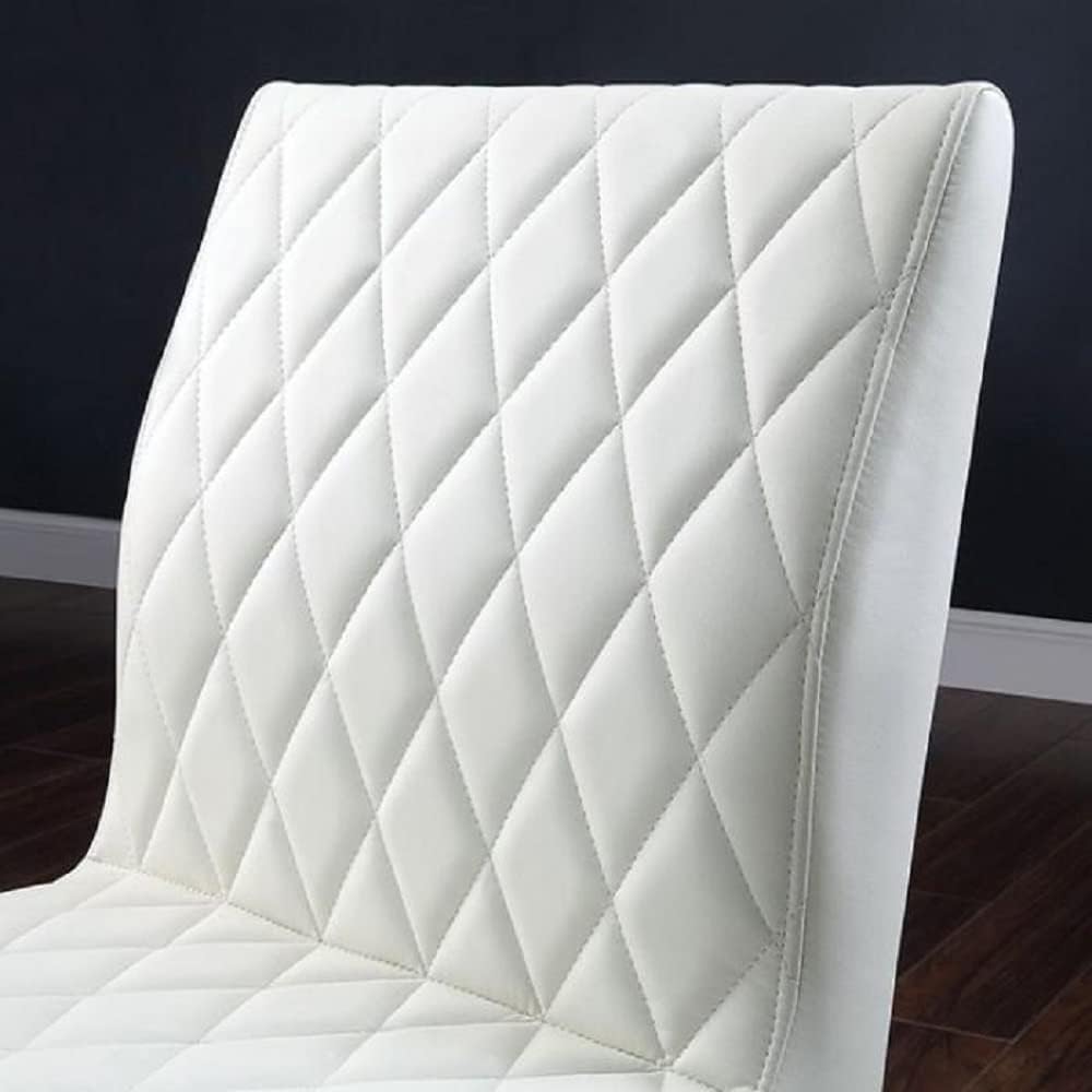 Closeup of white faux leather diamondstitched dining chair back