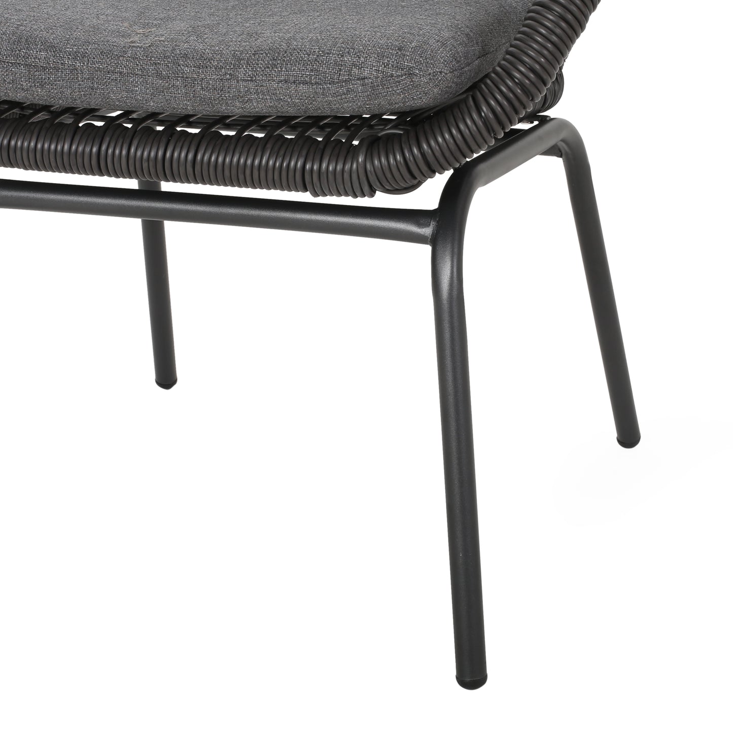 Closeup of a gray woven outdoor chairs metal legs and textured seat cushion showcasing quality craftsmanship