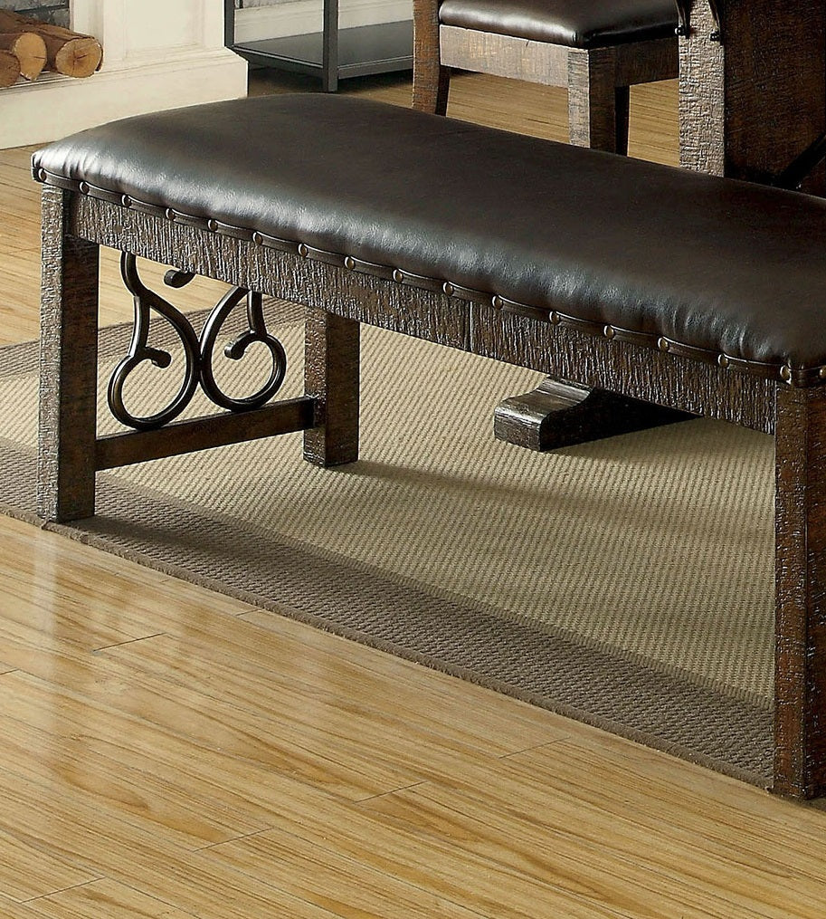 Dark brown faux leather upholstered bench with carved wooden legs and decorative metal accents