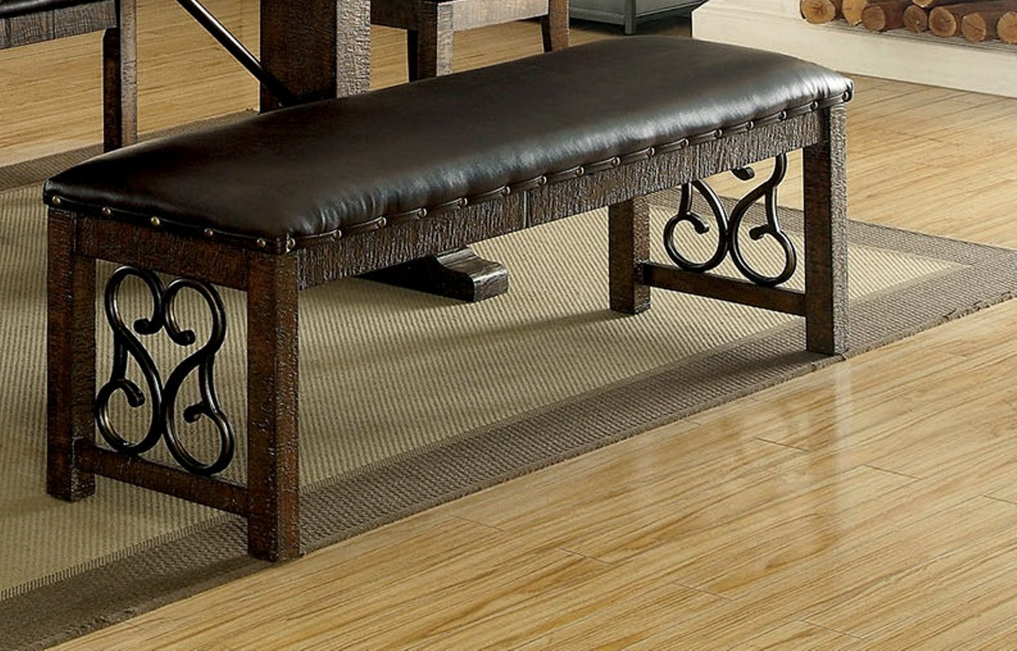 Dark brown leather tufted dining bench with distressed wood frame and ornate metal scroll legs