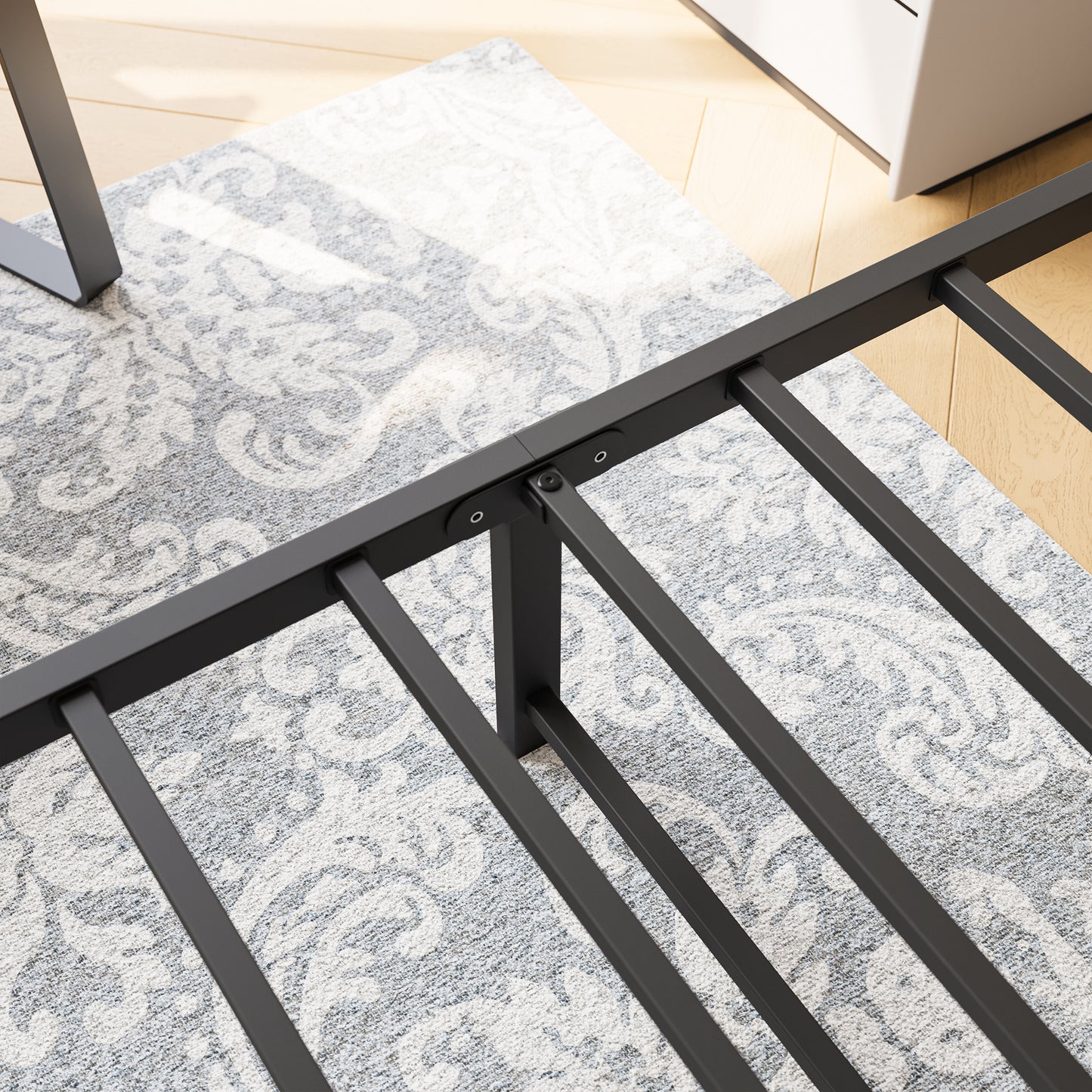 Black metal bed frame with sturdy slats and central support legs