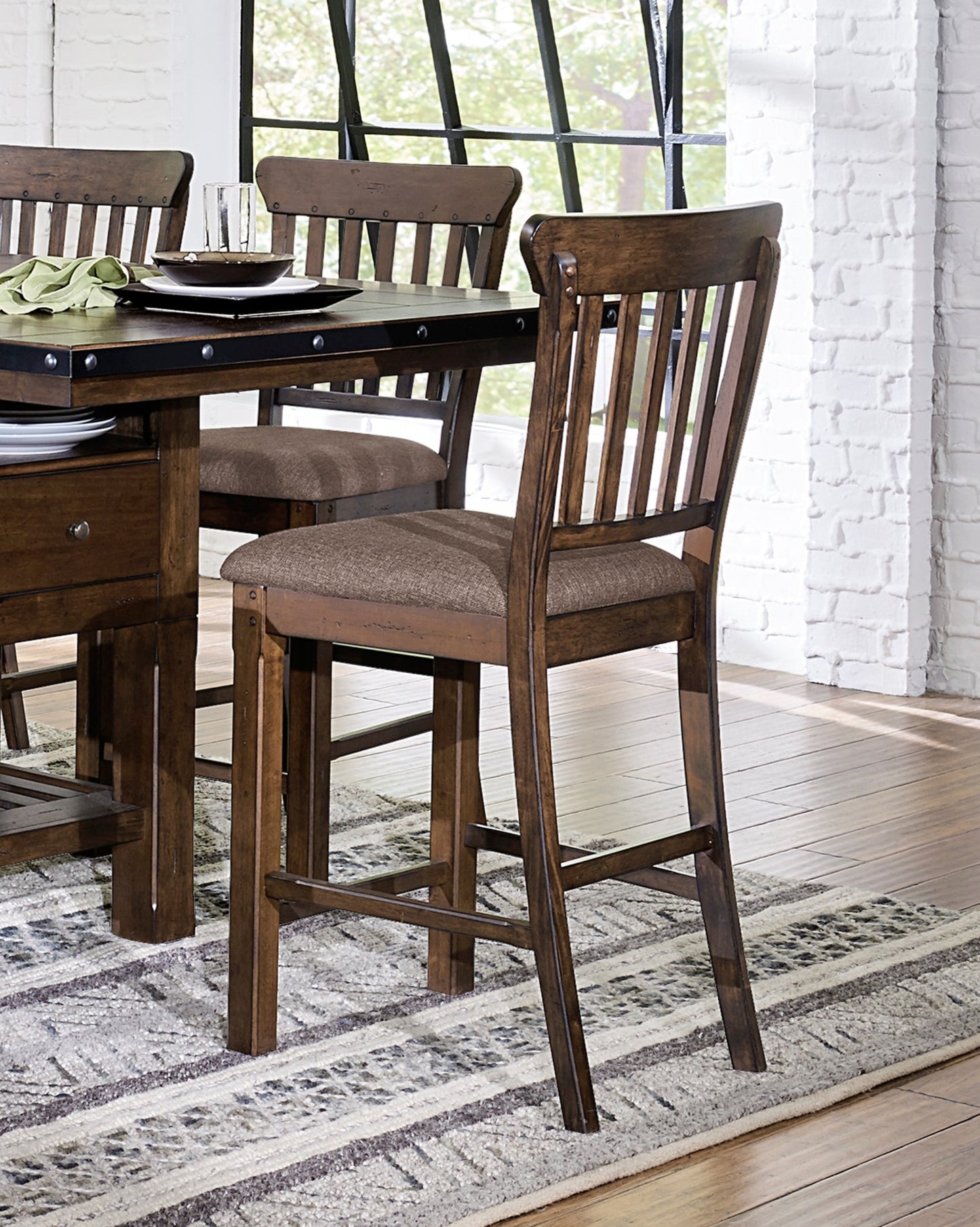 Dark brown wooden bar stool with cushioned seat