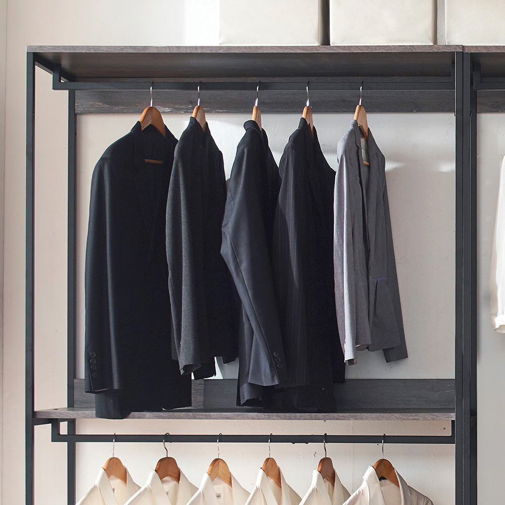 Black mens suit jacket with classic lapels on a wooden hanger