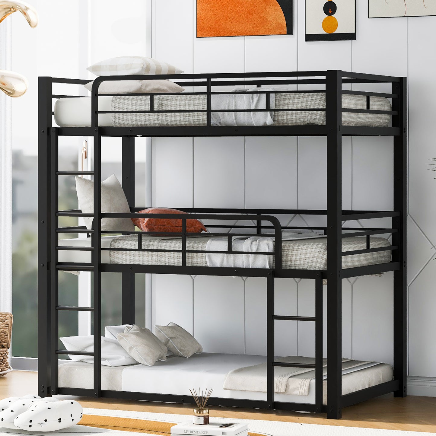 Black metal triple bunk bed with white bedding and pillows
