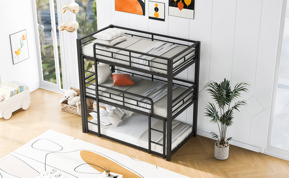 Black metal triple bunk bed with mattresses and pillows