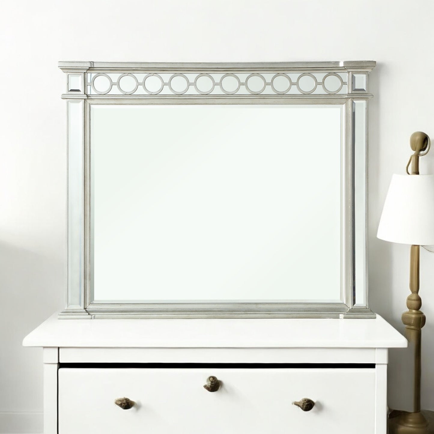 Ornate silver dresser mirror with decorative circle detail
