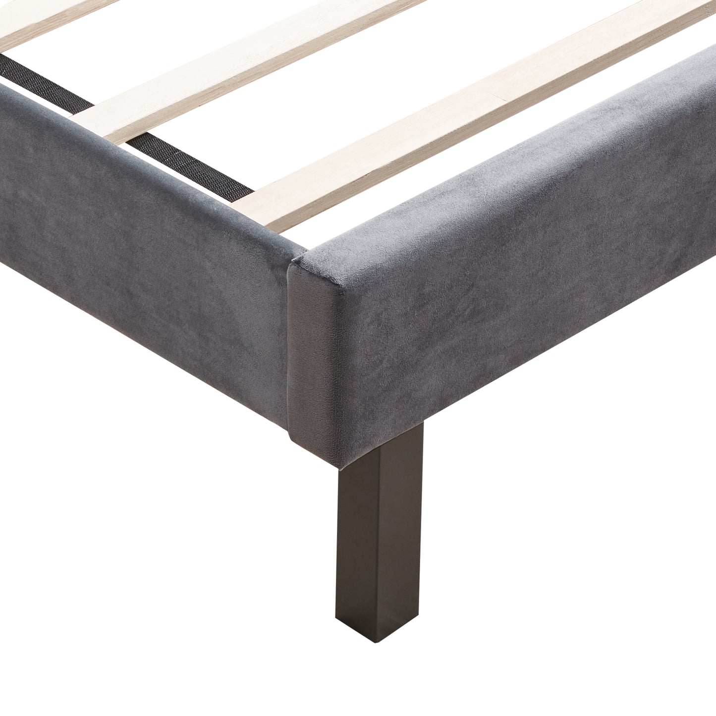 Grey velvet upholstered bed frame corner with black metal leg