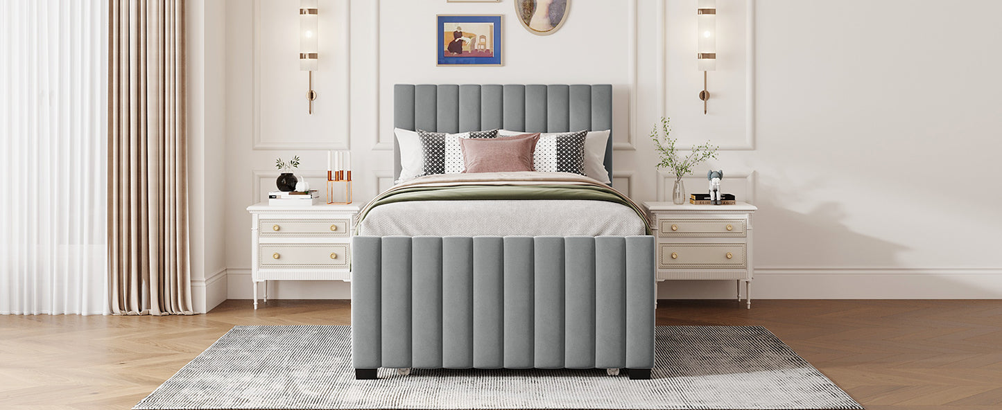 Gray upholstered platform bed with vertical channel tufting