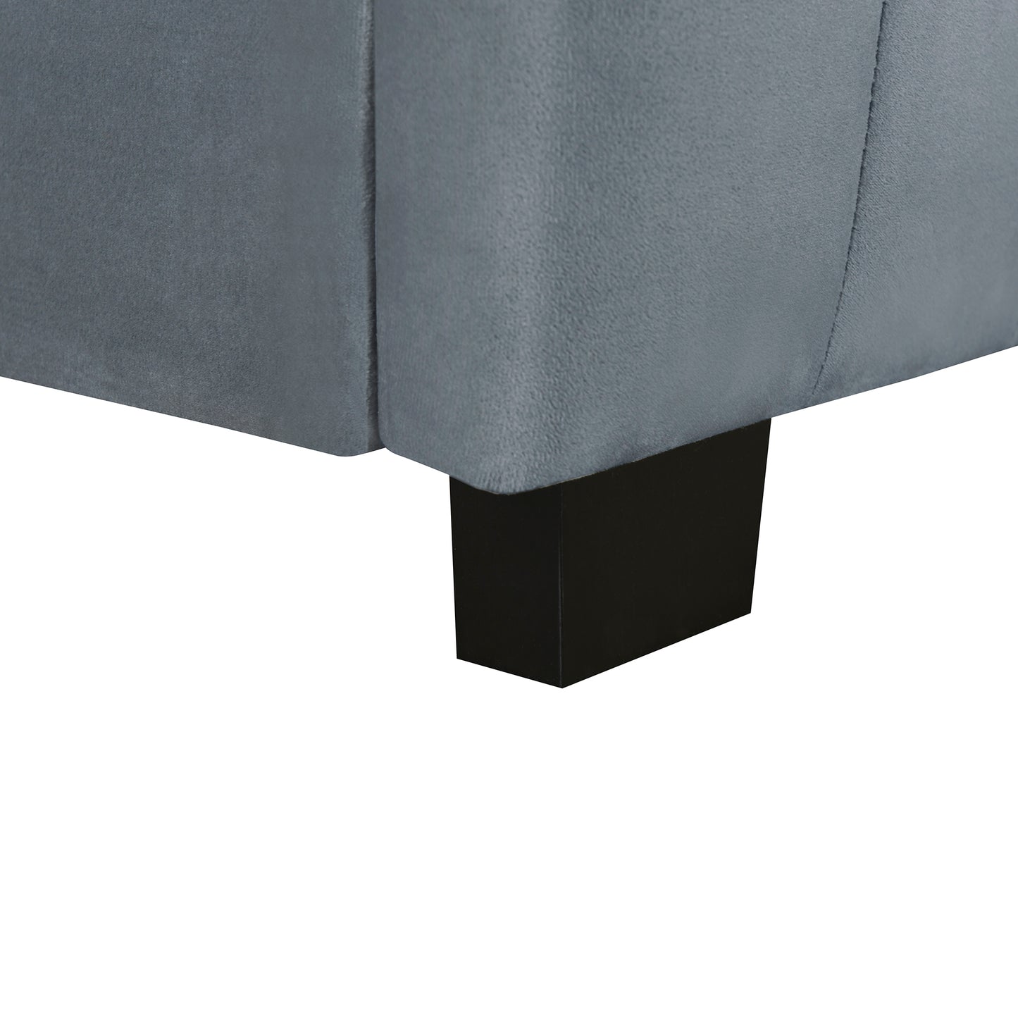 Gray fabric sofa corner with dark wood leg
