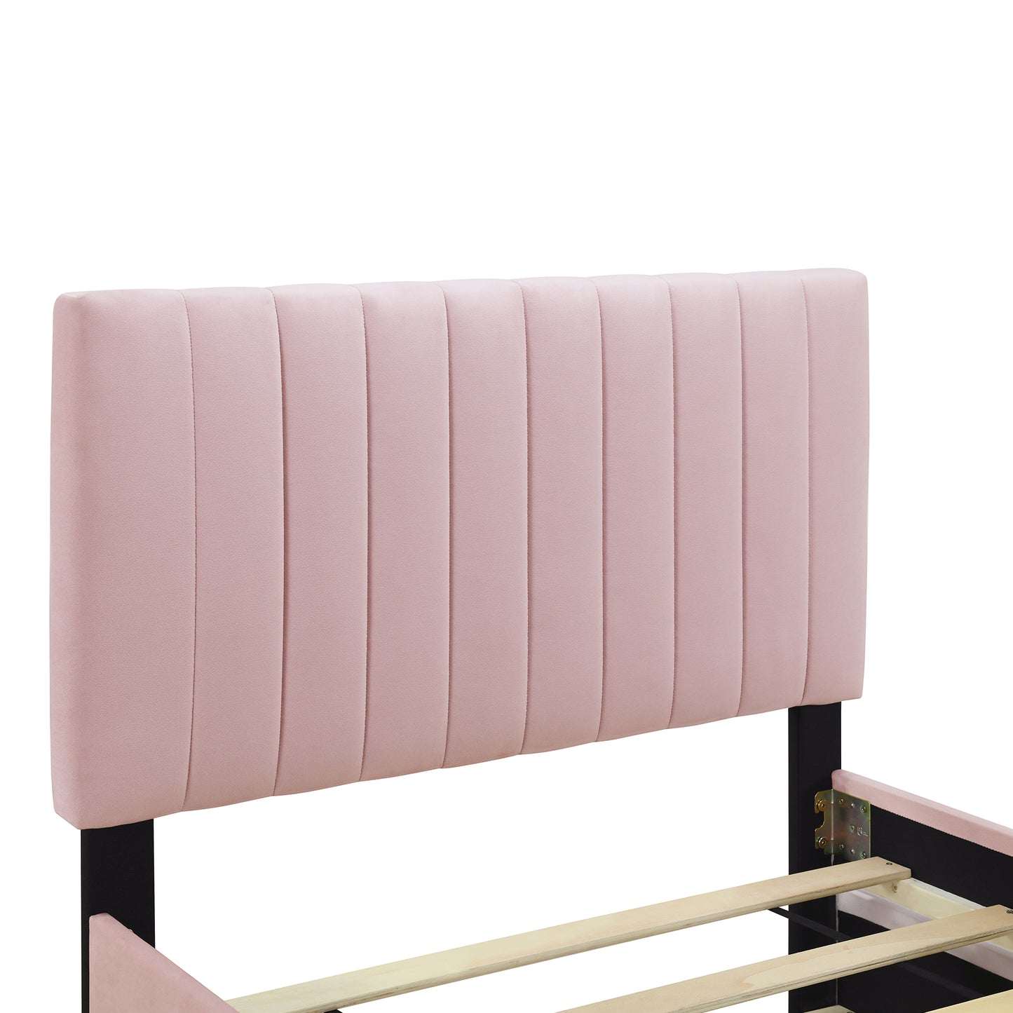 Pink velvet channel tufted headboard on a black metal bed frame with wood slats