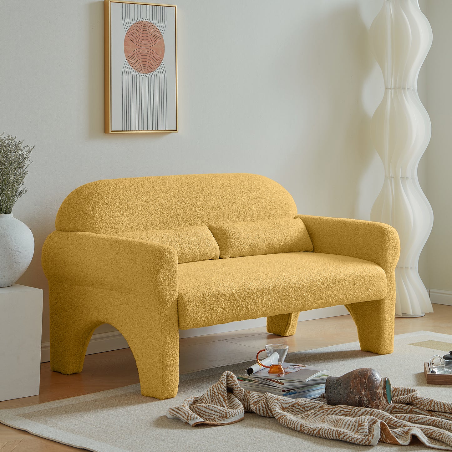 Mustard yellow boucl fabric loveseat with rounded arms and playful legs perfect for modern living rooms