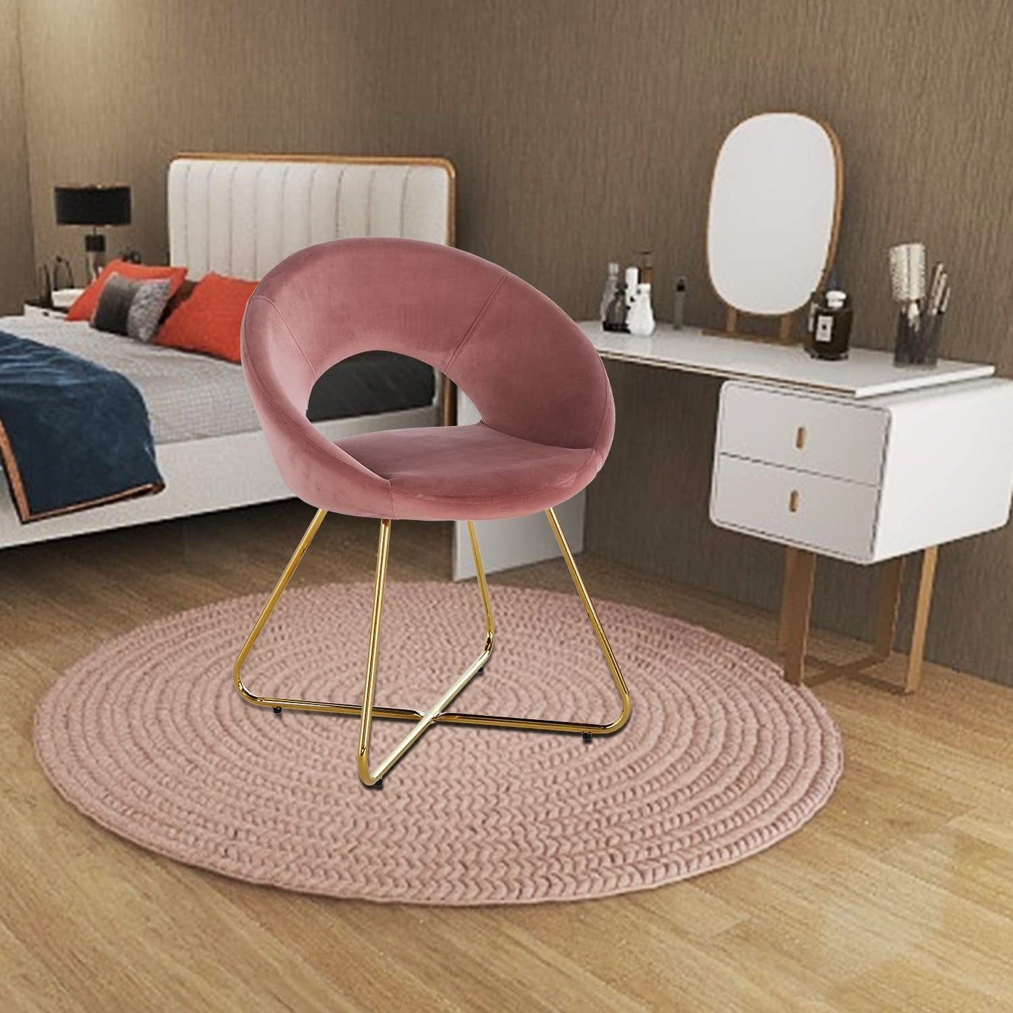 Pink velvet accent chair with gold metal legs and round seat