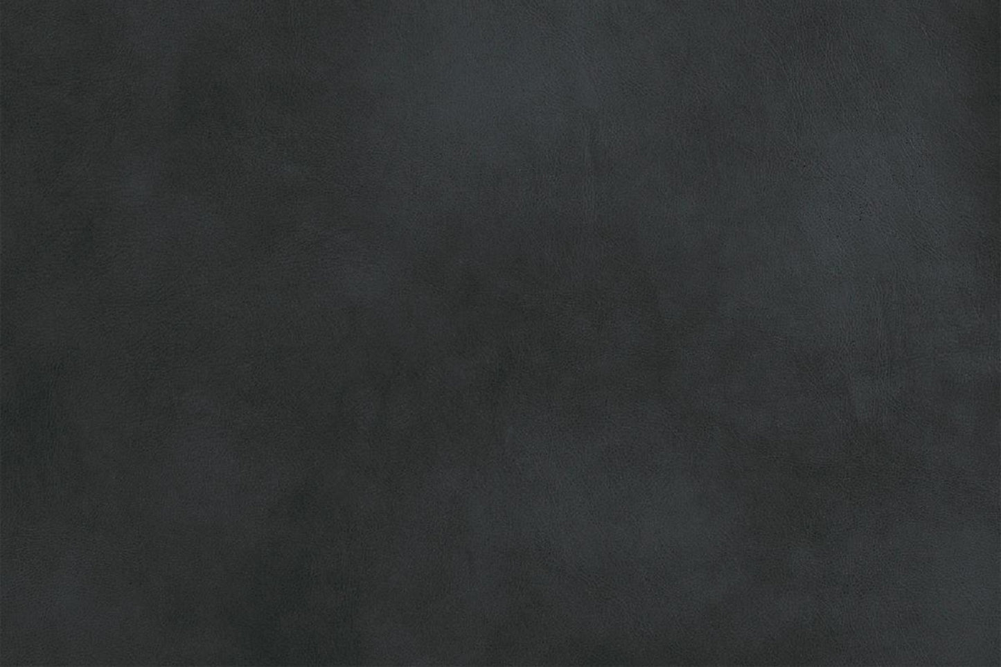Closeup of a textured dark grey leather fabric perfect for upholstery
