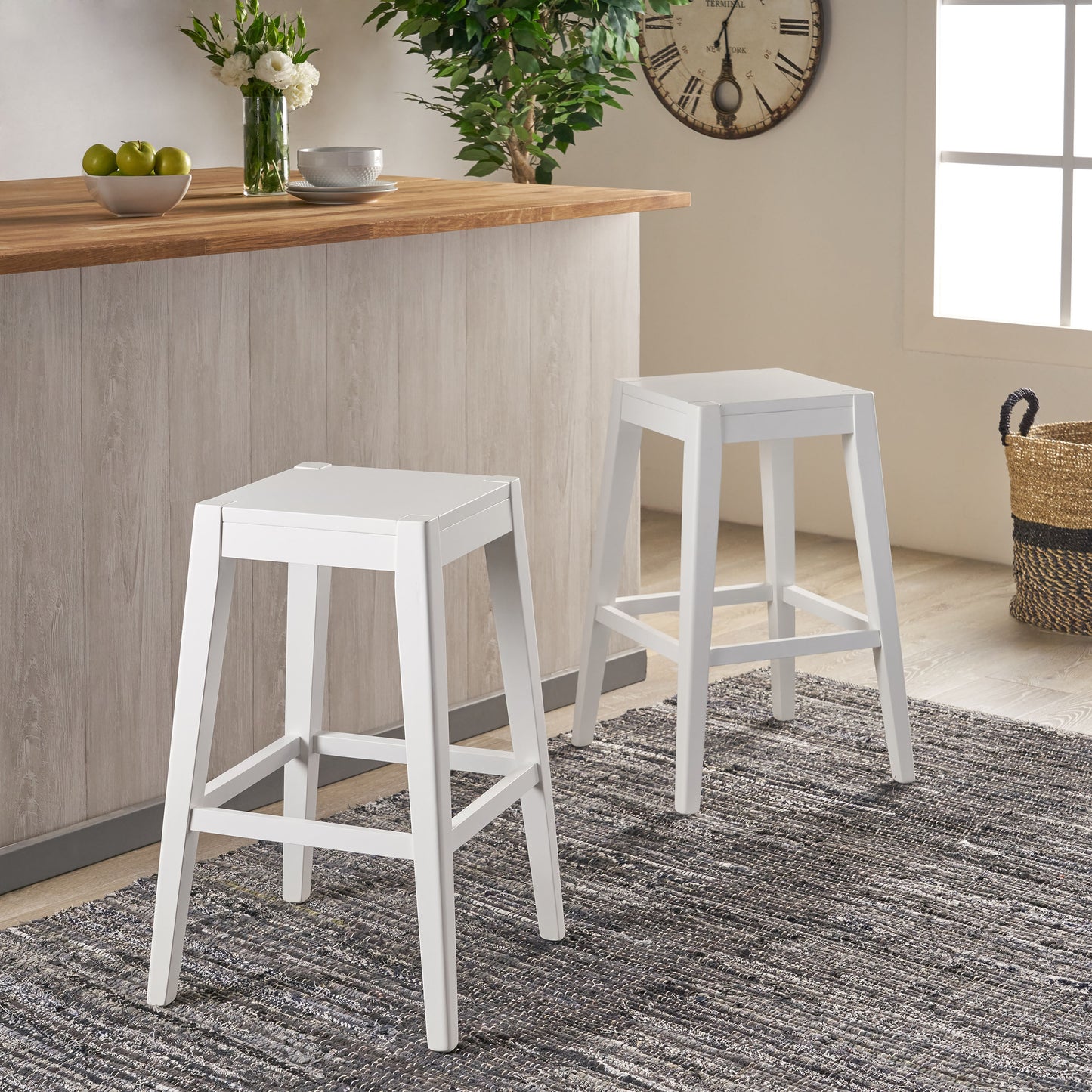 Two white modern counter stools with wooden legs and seats ideal for kitchen islands