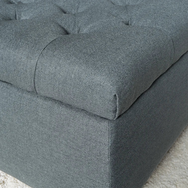 Tufted grey fabric ottoman with a clean modern design