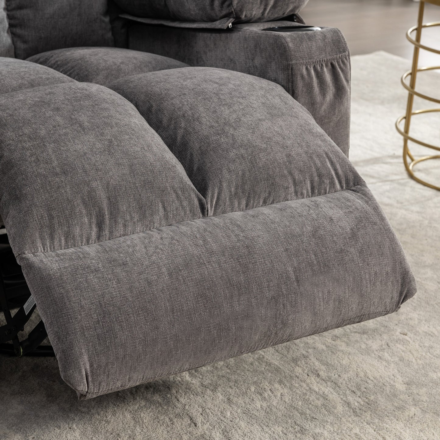 Padded grey fabric sofa section with plush cushioning for comfort