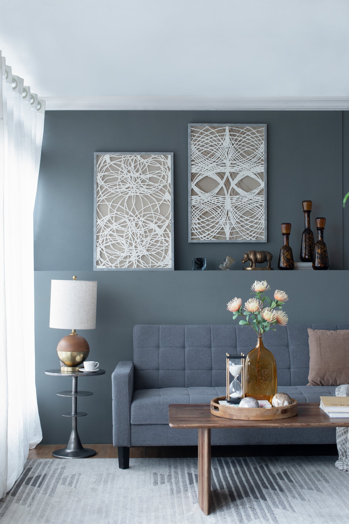 Grey upholstered sofa with a modern tufted design perfect for living rooms