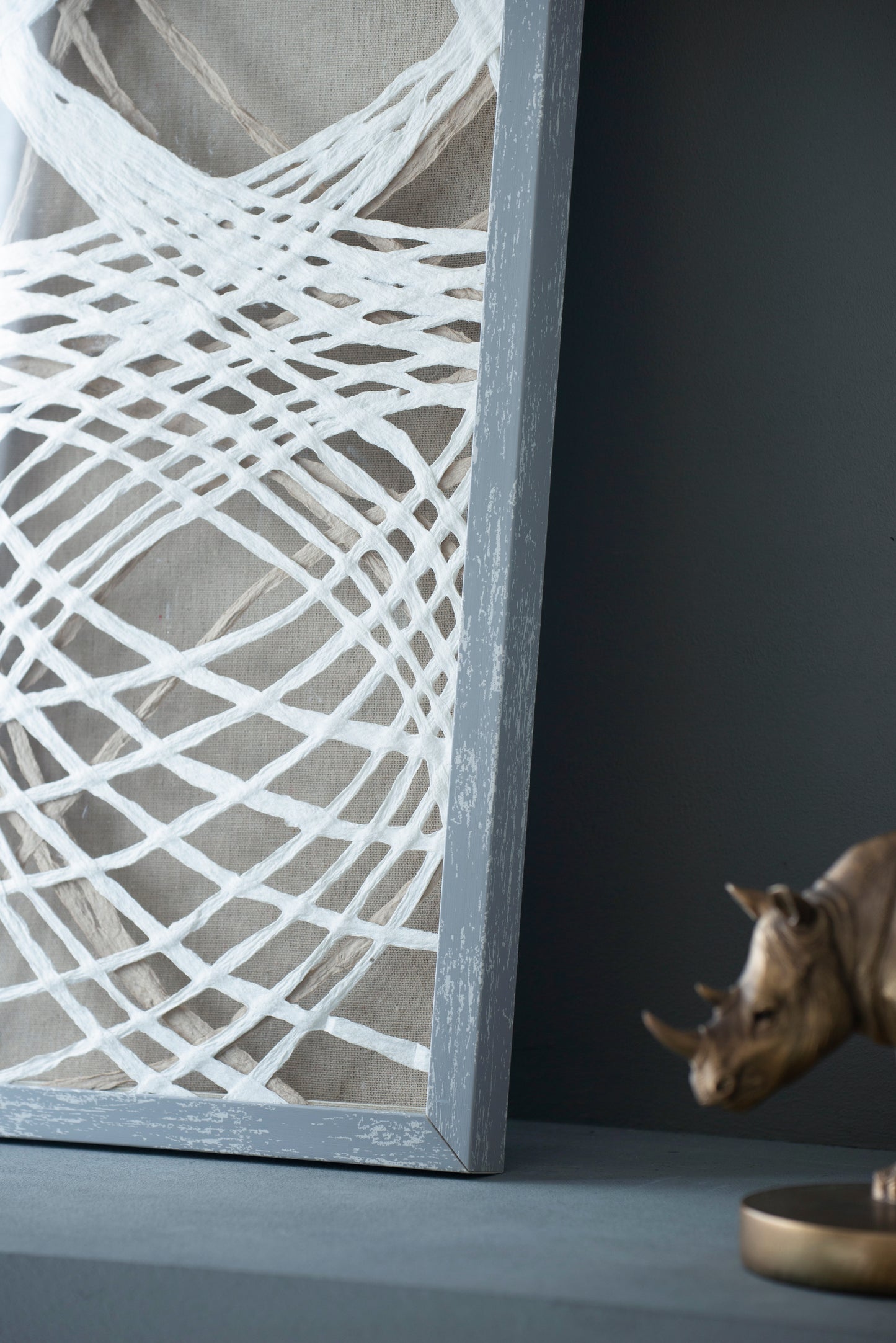 Textured linen canvas wall art with white string overlay and distressed gray frame
