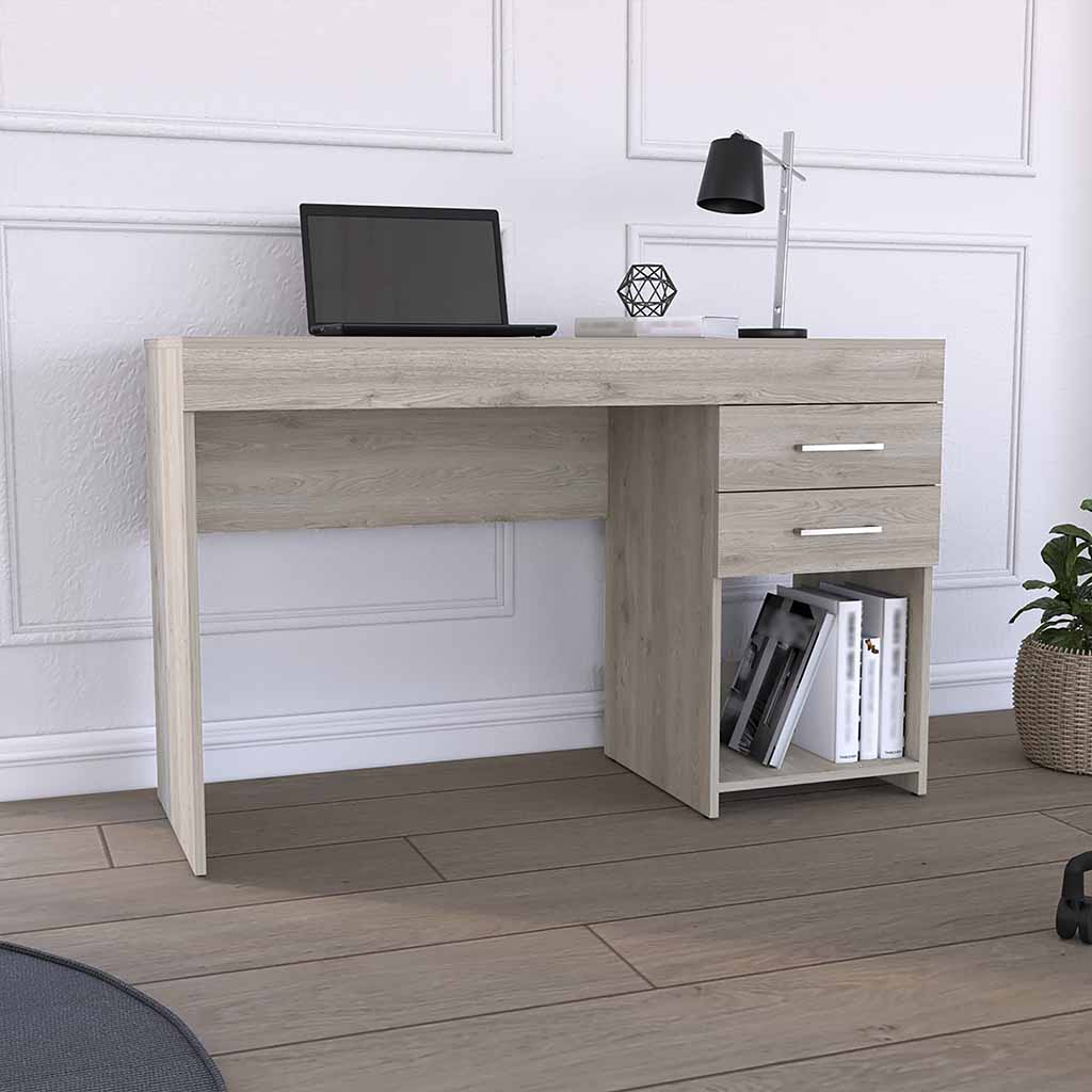 Light oak writing desk with two drawers and an open shelf displaying books