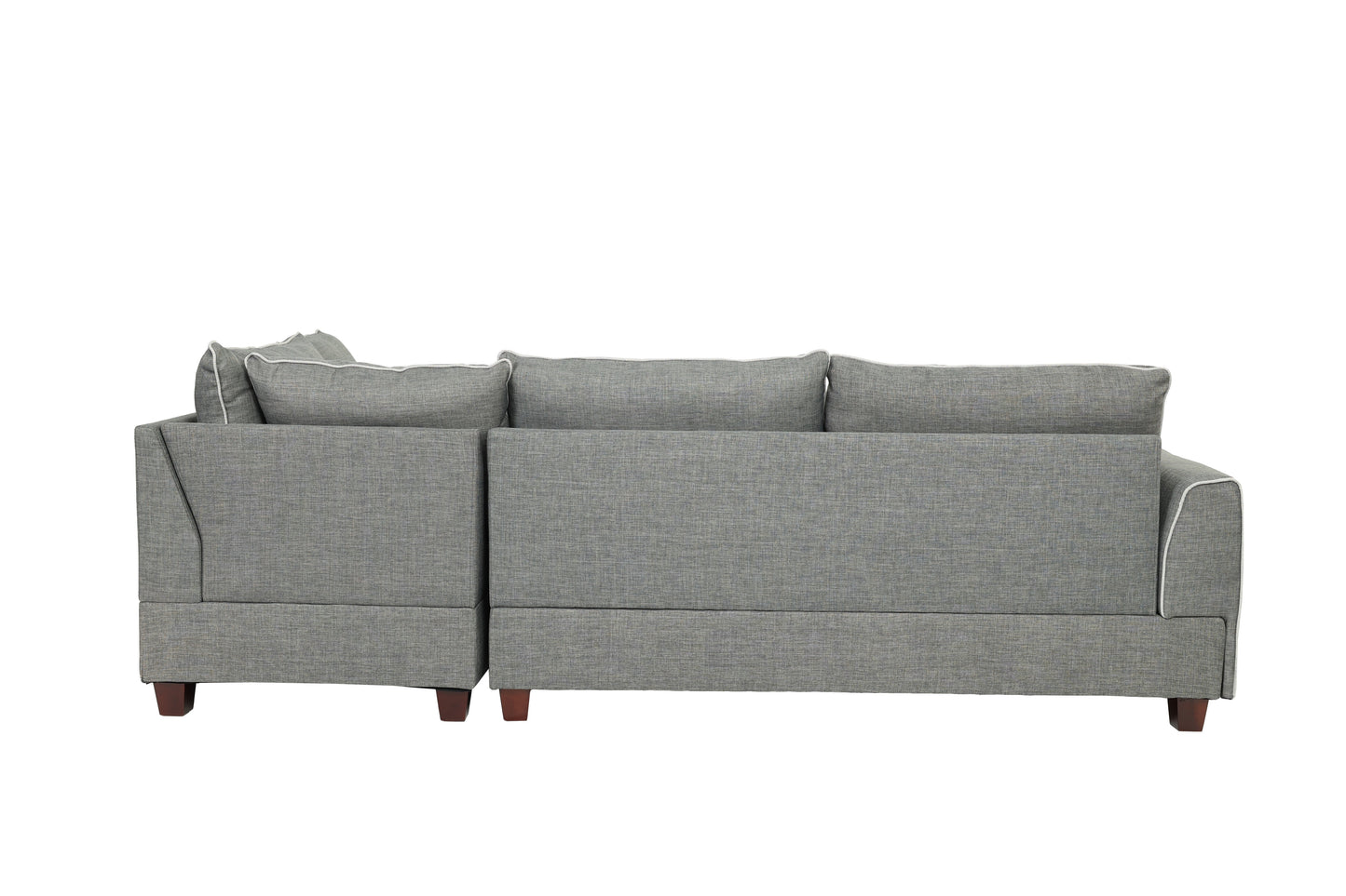 Grey upholstered sectional sofa with white piping on cushions