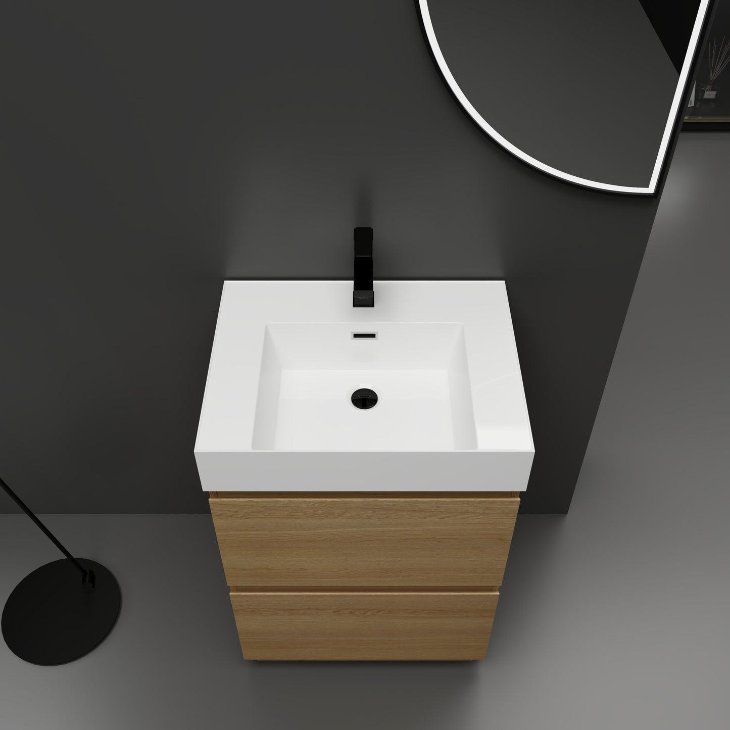 Modern white rectangular vanity sink with a matte black faucet and light oak wood cabinet