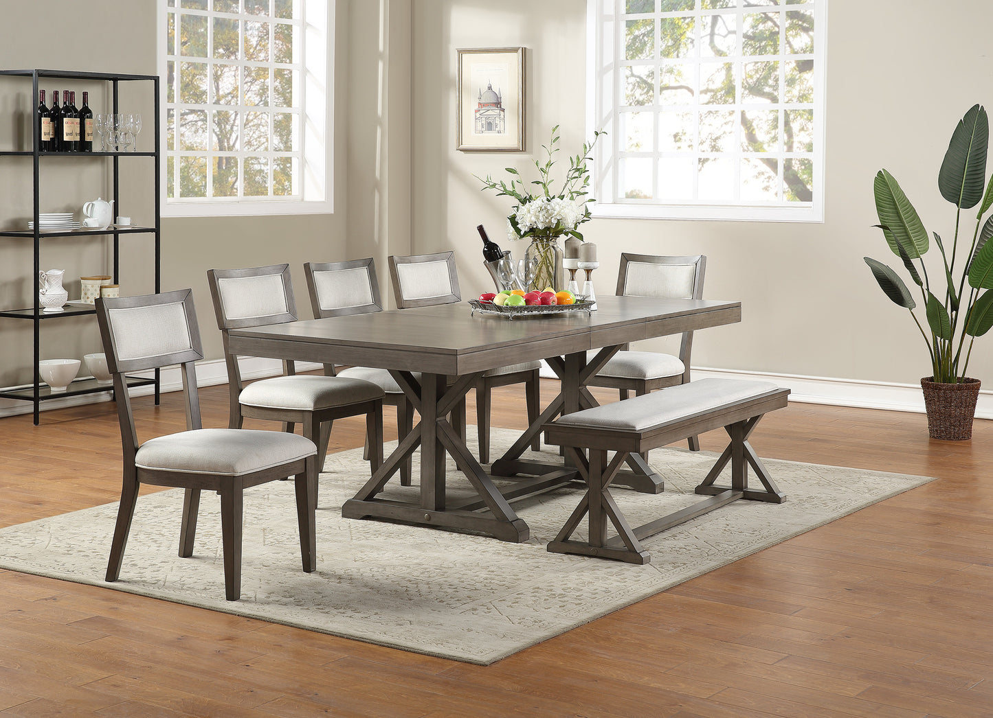 Gray dining table set with upholstered chairs and bench