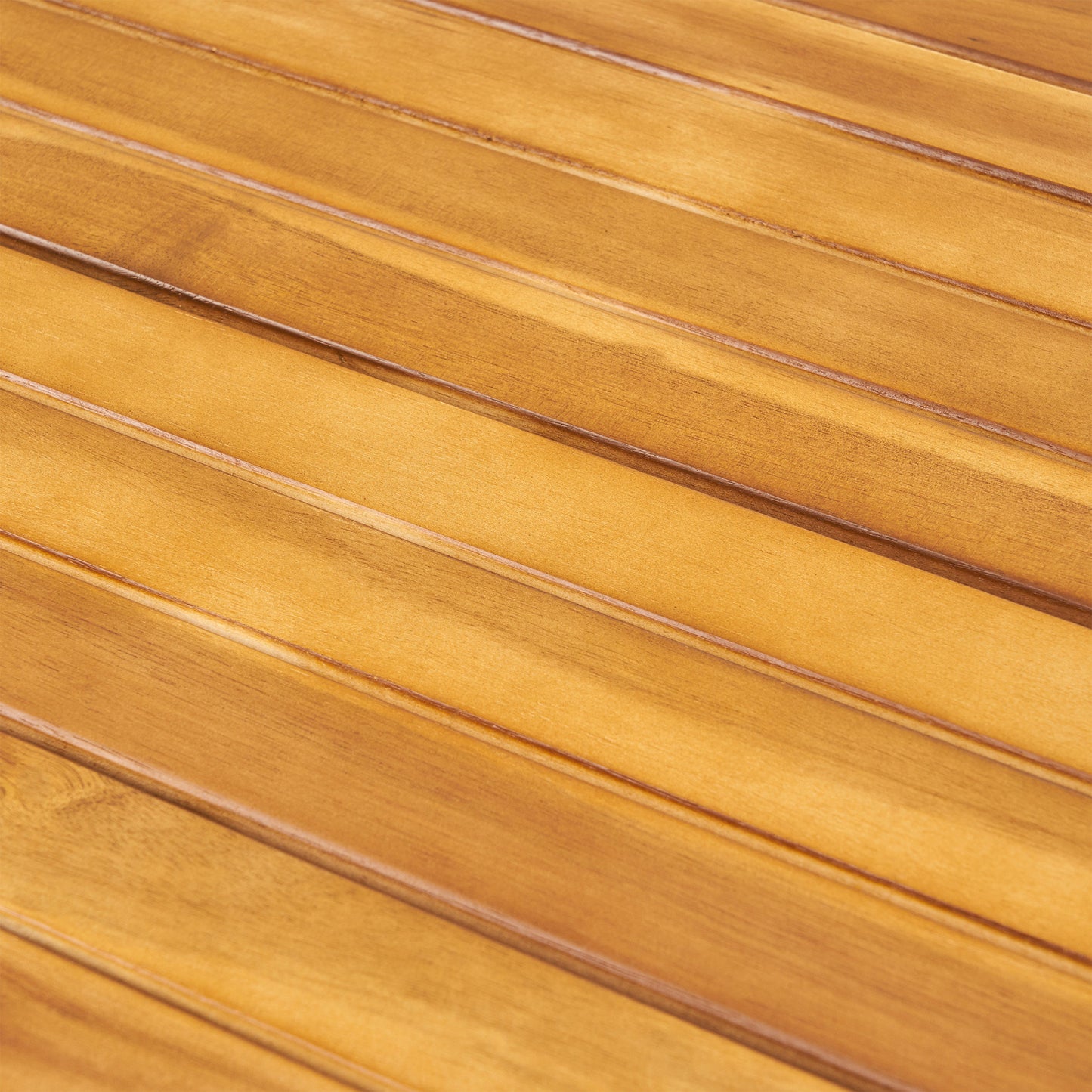 Closeup of polished teak wood planks with a warm honey finish ideal for outdoor furniture