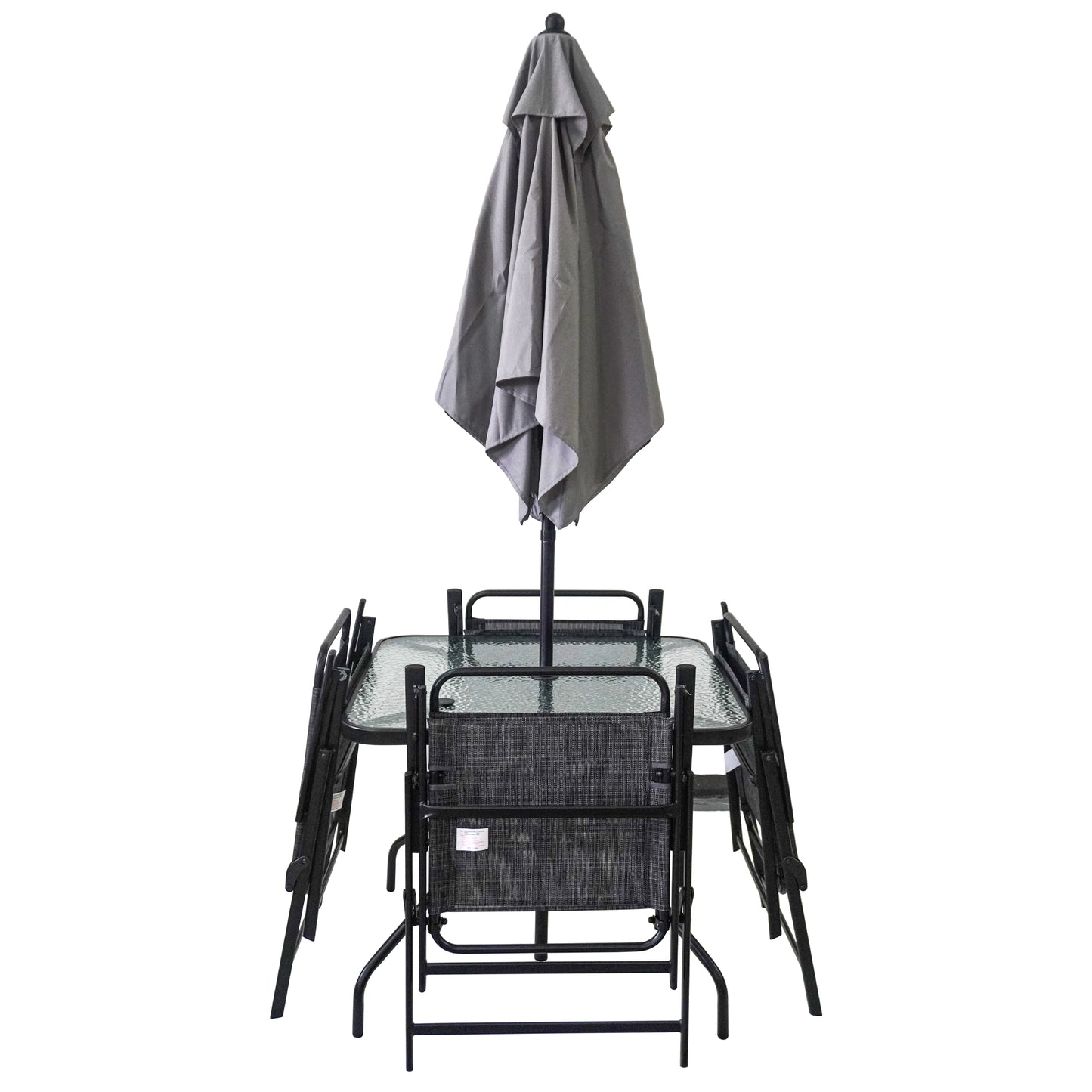 Glass top patio table with four folding chairs and closed grey umbrella
